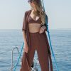 Nadia bikini and Nomad trousers in Shiny Bordeaux